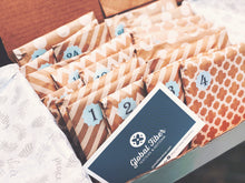 Load image into Gallery viewer, 2025 Quilter's Advent Calendar/Countdown Box. Filled with individually wrapped Fat Quarters and surprises. Available at globalfibershop.com.