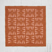 Load image into Gallery viewer, The Carpe Diem quilt - with its twist on the traditional hourglass block and its symbolism of time - serves as a reminder that the future is never guaranteed; and yet, what we do with the present shapes our tomorrow. By holding and reconciling these seemingly contradicting truths, we can work toward finding purpose, hope & joy in each day. Available at globalfibershop.com.