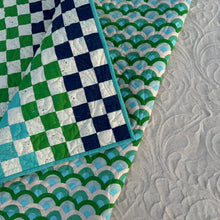 Load image into Gallery viewer, Close-up of various quilt patterns including checkered, scalloped, and textured.
