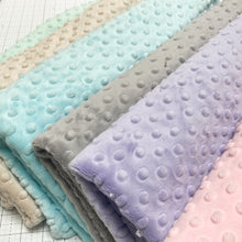 Load image into Gallery viewer, This exclusive Cuddle® minky plush fabric has a textured, velvety surface that features an adorable dimple embossed design. Not only does it look amazing sewn into quilts, baby products, apparel, etc., but it has a nice skin feel we can't get enough of! Available at globalfibershop.com.