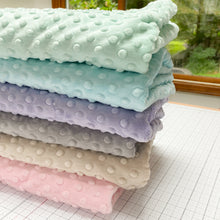 Load image into Gallery viewer, This exclusive Cuddle® minky plush fabric has a textured, velvety surface that features an adorable dimple embossed design. Not only does it look amazing sewn into quilts, baby products, apparel, etc., but it has a nice skin feel we can't get enough of! Available at globalfibershop.com.