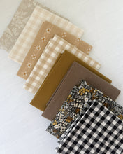 Load image into Gallery viewer, Collection of fabric swatches in brown, beige, and black and white patterns on a light background