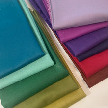 Load image into Gallery viewer, Peppered Cotton by Pepper Cory for Studio E is a shot cotton.  Shot Cotton uses one color thread for the warp and a different color thread for the weft, creating a beautiful "peppered" effect.  This collection is super soft with a gorgeous "textured" color effect. Available at globalfibershop.com.