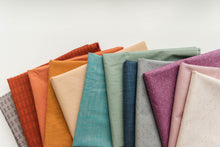 Load image into Gallery viewer, Wildflower Wovens embodies a handmade charm reminiscent of stumbling upon a wild, untamed floral marvel in the heart of nature. Available from globalfibershop.com.