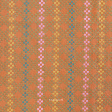 Load image into Gallery viewer, Woven fabric with a geometric design featuring shades of orange, pink, and green. Embrace the charm of the rainbow with Fableism Supply Co’s ‘Lucky Loom’ fabric collection—a dazzling fusion of mixed weight wovens inspired by moments of serendipity. This collection’s palette radiates warmth and whimsy, featuring golden yellows, soft pinks, earthy greens, tranquil blues, and rich purples, each reminiscent of the colors in a lucky rainbow. Available at globalfibershop.com.