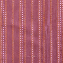 Load image into Gallery viewer, Textured fabric with vertical stripes in shades of purple and brown on a matching background. Embrace the charm of the rainbow with Fableism Supply Co’s ‘Lucky Loom’ fabric collection—a dazzling fusion of mixed weight wovens inspired by moments of serendipity. This collection’s palette radiates warmth and whimsy, featuring golden yellows, soft pinks, earthy greens, tranquil blues, and rich purples, each reminiscent of the colors in a lucky rainbow. Available at globalfibershop.com.