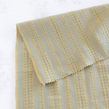 Load image into Gallery viewer, Embrace the charm of the rainbow with Fableism Supply Co’s ‘Lucky Loom’ fabric collection—a dazzling fusion of mixed weight wovens inspired by moments of serendipity. This collection’s palette radiates warmth and whimsy, featuring golden yellows, soft pinks, earthy greens, tranquil blues, and rich purples, each reminiscent of the colors in a lucky rainbow. Available at globalfibershop.com.