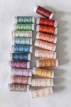 Load image into Gallery viewer, Aurifil's brand new 100% cotton 8wt thread in 20 brilliant hues is curated by Suzy Quilts. Available at globalfibershop.com.