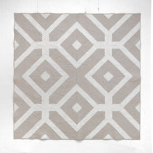 Load image into Gallery viewer, The Villager Quilt design reflects how “villagers” link arms and surround their community members in times of need. The two-tone Winter White version is available at globalfibershop.com.