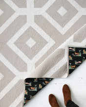 Load image into Gallery viewer, The Villager Quilt design reflects how “villagers” link arms and surround their community members in times of need. The two-tone Winter White version is available at globalfibershop.com.