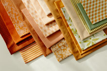 Load image into Gallery viewer, Wildflower Wovens embodies a handmade charm reminiscent of stumbling upon a wild, untamed floral marvel in the heart of nature. Available from globalfibershop.com.