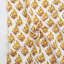Load image into Gallery viewer, Yellow and gold Floral patterned fabric with 'Fableism' branding on a white background. Indian Block Prints available at globalfibershop.com.