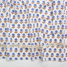 Load image into Gallery viewer, Floral patterned fabric with 'Fableism' branding on a white background. Indian Block Prints available at globalfibershop.com.