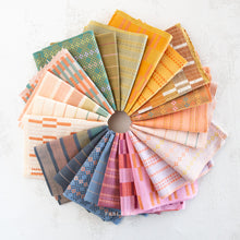 Load image into Gallery viewer, Embrace the charm of the rainbow with Fableism Supply Co’s ‘Lucky Loom’ fabric collection—a dazzling fusion of mixed weight wovens inspired by moments of serendipity. This collection’s palette radiates warmth and whimsy, featuring golden yellows, soft pinks, earthy greens, tranquil blues, and rich purples, each reminiscent of the colors in a lucky rainbow. Available at globalfibershop.com.