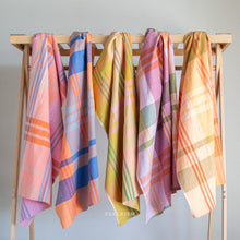 Load image into Gallery viewer, When you think light and cheery, think Lumiere. Fableism Supply Co.'s brand new wide-width 100% cotton collection with rainbows galore. Made with the apparel sewist in mind, they created these sunshiny cottons in a sweeping bouquet of prismatic rainbow color. Go bold or go retro! These wide width plaids and checkers will make for dazzling pieces. Available at globalifbershop.com.
