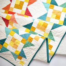 Load image into Gallery viewer, The Starlite Quilt Pattern is a wonderful scrap buster pattern. Fabric requirements are included in this listing. Global Fiber Shop also curated the Shining Bright bundle to go with this pattern. Paper pattern available at globalfibershop.com.