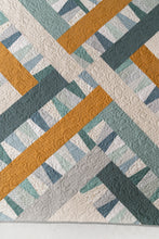 Load image into Gallery viewer, Garland quilt pattern by Suzy Quilts in Winter Walk colorway of light blue, teal and gold. Quilt kits available at globalfibershop.com.