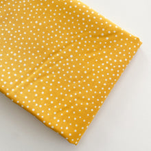 Load image into Gallery viewer, Close up of Happiest Dots in Morning Sun from RJR Fabrics. Happies Dots features organic white polka prints on a background of modern colors.