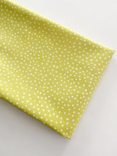 Load image into Gallery viewer, Close up of Happiest Dots in Mellow Lime from RJR Fabrics. Happies Dots features organic white polka prints on a background of modern colors.