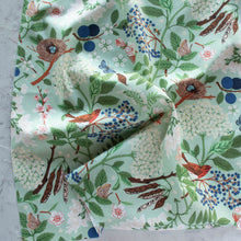 Load image into Gallery viewer, Gander the trees that produce the most beautiful of blooms, attracting lovely birds, butterflies, and bees to drink nectar, play in pollen, and seek shelter in their branches. Flowering trees features 13 prints on undyed organic cotton poplin. Sold at globalfibershop.com