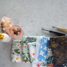 Load image into Gallery viewer, Gander the trees that produce the most beautiful of blooms, attracting lovely birds, butterflies, and bees to drink nectar, play in pollen, and seek shelter in their branches. Flowering trees features 13 prints on undyed organic cotton poplin. Sold at globalfibershop.com