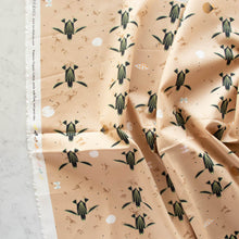 Load image into Gallery viewer, Turtles trek past a beach with shells printed on 100% GOT certified organic cotton poplin for Birch Fabrics.