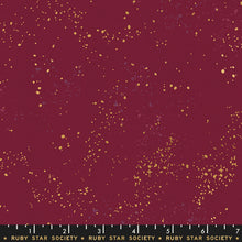 Load image into Gallery viewer, Speckled, brought to you by RSS designer Rashida Coleman Hall, features subtle speckled, (some metallic) blenders. We liken "speckled" to your happiest accident paint splatter turned perfect fabric background or blender. Wine Time is a purple background with gold and purple speckles.