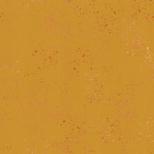 Load image into Gallery viewer, Speckled, brought to you by RSS designer Rashida Coleman Hall features subtle speckled, some metallic, blenders. We liken "speckled" to your happiest accident paint splatter turned perfect fabric background or blender. Cactus is a mustard yellow background with rust and pink speckles.