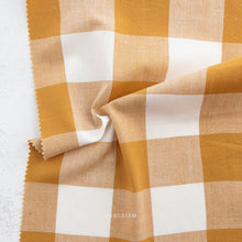 Load image into Gallery viewer, Camp Ginghams collection brings forth a classic woven style in gorgeous colors, reminiscent of retro camp uniforms. Think Moonrise Kingdom meets classic gingham! Camp Gingham is offering two sizes of yarn-dyed cotton gingham 3/8″ and 2.25″. Each size has a multitude of purposes from quilts, to apparel, to table settings! Sold at globalfibershop.com.