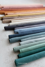 Load image into Gallery viewer, This debut collection from Fableism Supply Company features 28 shades of yarn-dyed wovens in stunning earth tones inspired by natural elements .  The small woven-X provides just enough texture to elevate this gorgeous substrate to the next level. Available at globafibershop.com.