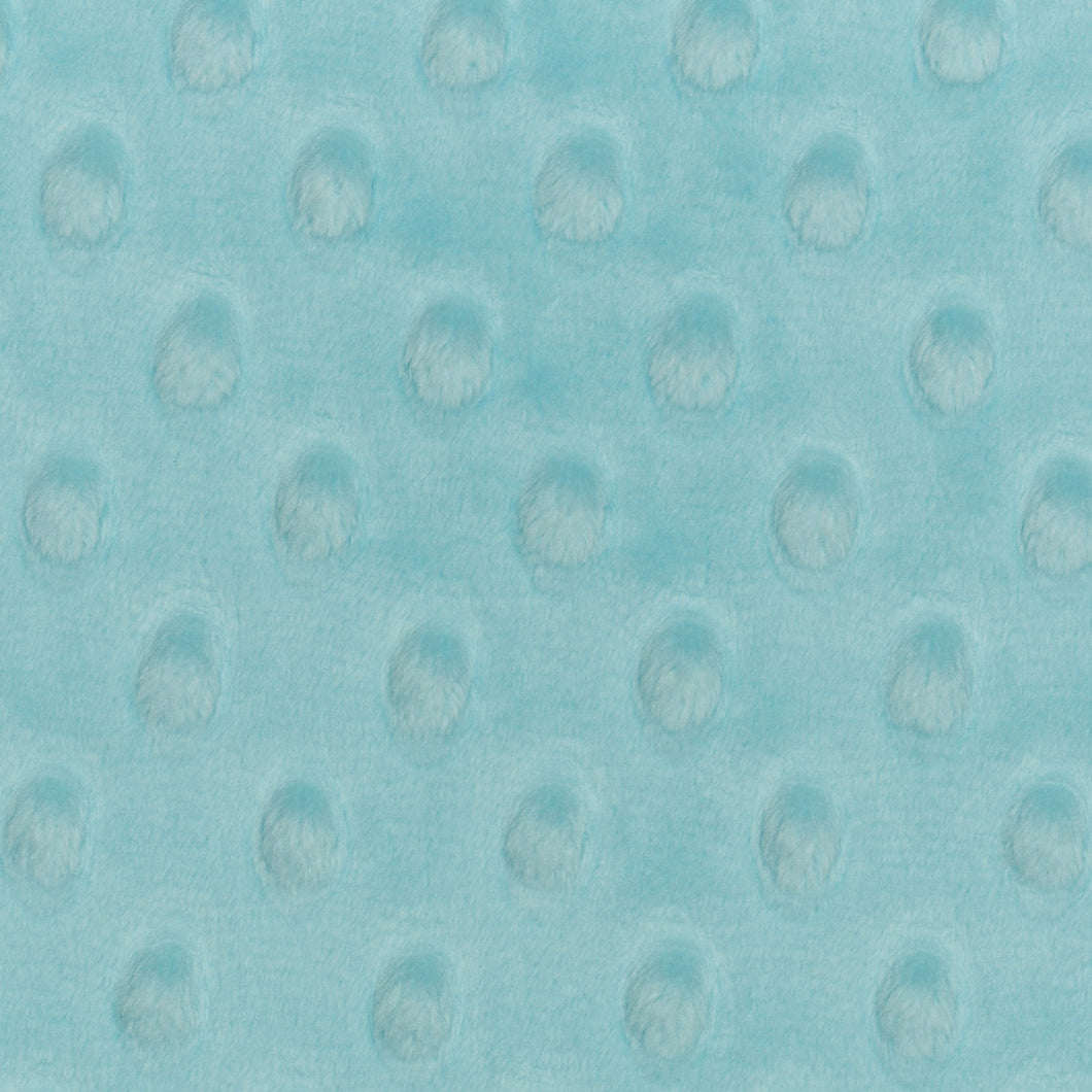 This exclusive Cuddle® minky plush fabric has a textured, velvety surface that features an adorable dimple embossed design. Not only does it look amazing sewn into quilts, baby products, apparel, etc., but it has a nice skin feel we can't get enough of! Available at globalfibershop.com.