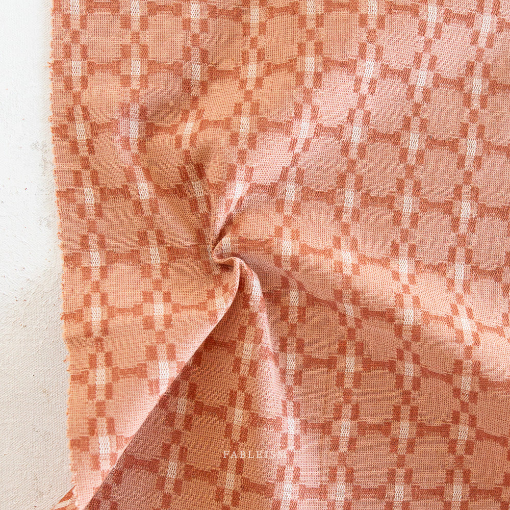 Golden Hour is a mixed weight cotton woven fabric collection by Fableism Supply Co. The palette is made of golden hues of light and graceful purples of a cool dusky night. Available at globalfibershop.com.