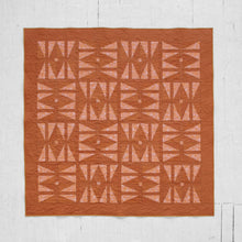 Load image into Gallery viewer, The Carpe Diem quilt - with its twist on the traditional hourglass block and its symbolism of time - serves as a reminder that the future is never guaranteed; and yet, what we do with the present shapes our tomorrow. By holding and reconciling these seemingly contradicting truths, we can work toward finding purpose, hope &amp; joy in each day. Available at globalfibershop.com.
