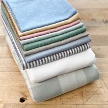 Load image into Gallery viewer, Our scrappy Cozy Cottage bundle from The Seasoned Homemaker features 6 fat quarters from Fableism Supply Co. in muted hues on a white background. Sold exclusively at globalfibershop.com.
