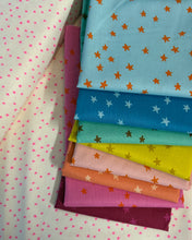 Load image into Gallery viewer, Rainbow set of colorful fabric swatches with star patterns on a white background. Starry available at globalfibershop.com.
