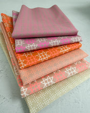 Load image into Gallery viewer, Stack of patterned fabric sheets on a light gray background. From Paper Cuts by Ruby Star Society available at Global Fiber Shop.
