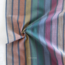 Load image into Gallery viewer, Embrace the charm of the rainbow with Fableism Supply Co’s ‘Lucky Loom’ fabric collection—a dazzling fusion of mixed weight wovens inspired by moments of serendipity. This collection’s palette radiates warmth and whimsy, featuring golden yellows, soft pinks, earthy greens, tranquil blues, and rich purples, each reminiscent of the colors in a lucky rainbow. Available at globalfibershop.com.
