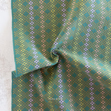 Load image into Gallery viewer, Blue and orange woven fabric.  Embrace the charm of the rainbow with Fableism Supply Co’s ‘Lucky Loom’ fabric collection—a dazzling fusion of mixed weight wovens inspired by moments of serendipity. This collection’s palette radiates warmth and whimsy, featuring golden yellows, soft pinks, earthy greens, tranquil blues, and rich purples, each reminiscent of the colors in a lucky rainbow. Available at globalfibershop.com.
