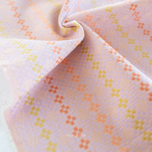 Load image into Gallery viewer, Close-up of woven fabric with small geometric design on a light background.  Embrace the charm of the rainbow with Fableism Supply Co’s ‘Lucky Loom’ fabric collection—a dazzling fusion of mixed weight wovens inspired by moments of serendipity. This collection’s palette radiates warmth and whimsy, featuring golden yellows, soft pinks, earthy greens, tranquil blues, and rich purples, each reminiscent of the colors in a lucky rainbow. Available at globalfibershop.com.
