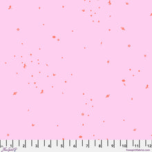 Load image into Gallery viewer, A pink fabric swatch with a scattered pattern of small red-orange whimsical motifs, including stars, hearts, flowers, and planets, with a ruler at the bottom indicating scale.
