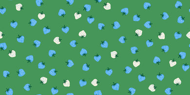 Pattern of blue and white strawberries on a green background