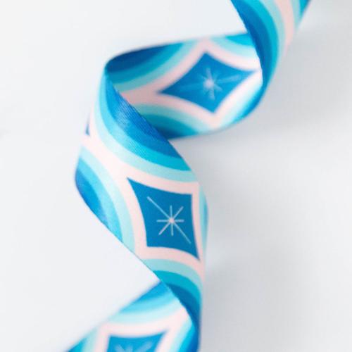 Decorative ribbon with blue and pink geometric pattern on a white background.  Designed by Ruby Star Society available at globalfibershop.com