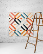 The Villager Quilt design reflects how “villagers” link arms and surround their community members in times of need. This scrappy bundle features signature solids from Suzy Quilts for Art Gallery Fabrics.Available at globalfibershop.com.