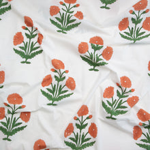 Load image into Gallery viewer, Block printed fabric with orange floral patterns on a white background. Available at globalfibershop.com.
