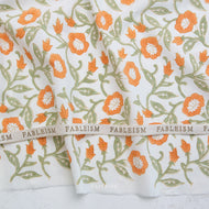 Floral patterned fabric with 'Fableism' branding on a white background. Indian Block Prints available at globalfibershop.com.