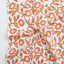 Load image into Gallery viewer, Floral patterned fabric with orange flowers on a white background. Available at globalfibershop.com.
