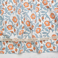 Floral patterned fabric with 'Fableism' branding on a white background. Indian Block Prints by Fableism available at globalfibershop.com.
