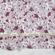 Fabric with a purple floral pattern and 'Fableism' branding. Indian Block Prints available at globalfibershop.com.