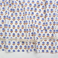 Floral patterned fabric with 'Fableism' branding on a white background. Indian Block Prints available at globalfibershop.com.