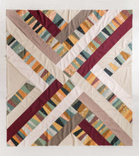 Load image into Gallery viewer, Garland quilt pattern by Suzy Quilts in Summer Falling colorway of earthy blues, sages, merlot and gold. Featured prints from the Summer Folk collection and peppered cottons. Quilt kits available at globalfibershop.com.
